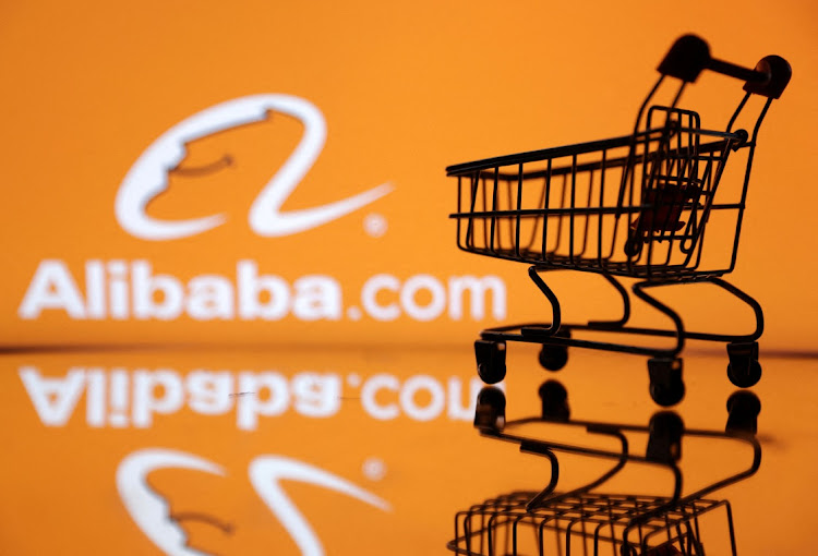 A shopping trolley is seen in front of Alibaba logo in this illustration. Picture: DADO RUVIC/REUTERS
