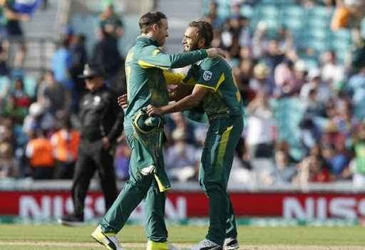 South Africa’s Imran Tahir (R) celebrates with South Africa’s Captain AB de Villiers after winning the ICC Champions Trophy match between South Africa and Sri Lanka at The Oval in London on June 3, 2017.