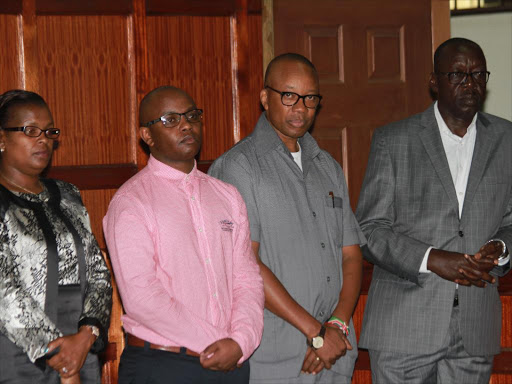 Businesspeople Regina Mungai and Ben Gethi alongside former National Youth Service director general Nelson Githinji and former Devolution PS Peter Mangiti at the Milimani law courts on February 16 /PHILIP KAMAKYA