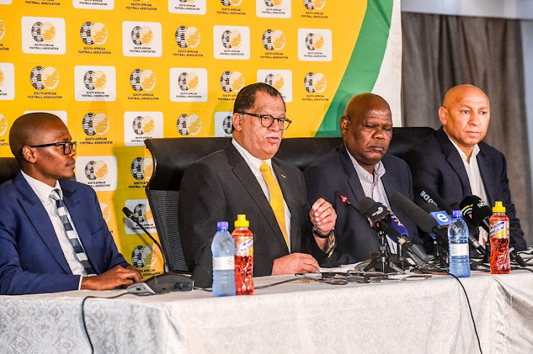 Danny Jordaan (President) of SAFA with Dr Thulani Ngwenya, Gaye Mokoena (acting CEO) and an executive member of SAFA as they announce cancellation of all football in South Africa during the SAFA press conference at SAFA House on March 18, 2020 in Johannesburg, South Africa.