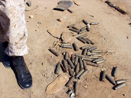 A soldier from the Sudan People’s Liberation Movement (SPLM) walks past spent bullet cartridges in the recent fighting in the Jabel area of Juba, South Sudan, July 16, 2016. /REUTERS