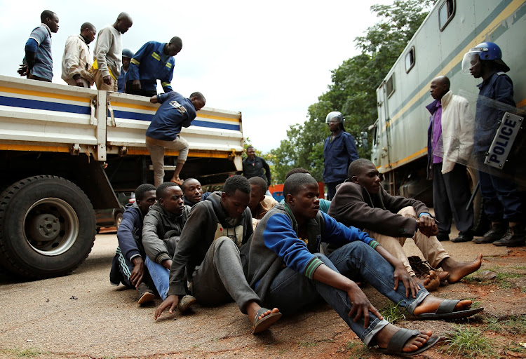 People arrested during protests wait to appear in the Magistrates court in Harare, Zimbabwe, January 16, 2019.