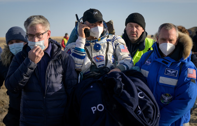 The International Space Station (ISS) crew member NASA astronaut Mark Vande Hei is carried to a medical tent shortly after landing with the Soyuz MS-19 space capsule in a remote area outside Zhezkazgan, Kazakhstan March 30, 2022.