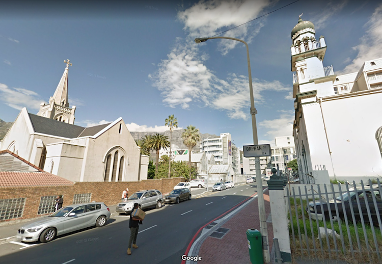 The corner of Loop and Orphan streets in Cape Town, with the Lutheran Evangelical Church on the left, and the Coowatool Mosque on the right.
