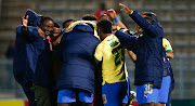 Mamelodi Sundowns coach Rulani Mokwena (left) and his players celebrate their penalties victory in their Nedbank Cup quarterfinal against University of Pretoria FC at Lucas Moripe Stadium on Friday.