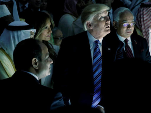 US President Donald Trump (C) and other leaders react to a wall of computer screens coming online as they tour the Global Center for Combatting Extremist Ideology in Riyadh, Saudi Arabia May 21, 2017. /REUTERS