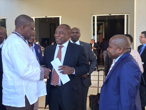 Hosi Shilungwa Mhinga II, who is the chief of the Mhinga clan in Malamulele, Limpopo, gives deputy President Cyril Ramaphosa a list of issues the community is facing. They are flanked by Cogta Minister Des van Rooyen.