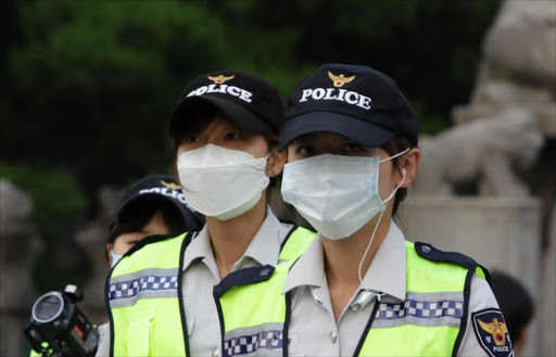 Policemen wear masks as a precaution to protect them against the MERS virus on June 10, 2015 in Seoul, South Korea. South Korea. Picture Credit: Getty Images