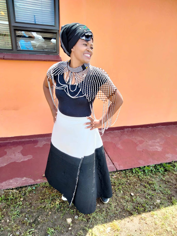 Thandiswa Zazini showcases the intricate beadwork made by members of her Rise Up Organisation.