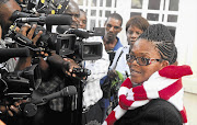 Human rights lawyer Beatrice Mtetwa speaks to journalists outside the Harare High Court after being released on bail yesterday. She spent a week in jail, raising fears of a crackdown on activists ahead of elections later this year.