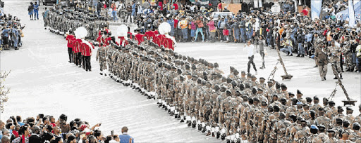 MARCH CHAOS: SANDF members from the 14 South African Infantry Battalion march through the streets of Mthatha during Freedom of the City festivities yesterday that caused huge traffic snarl-ups in and around the city Picture: LULAMILE FENI