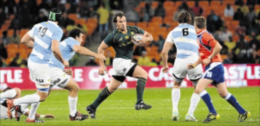 BATTERING RAM: Springbok hooker Bismarck du Plessis is challenged by Argentina players during the Rugby Championship match at FNB Stadium in SowetoPhoto: Gallo Images