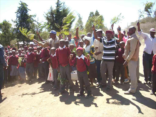 Parents and pupils of Kagaa primary school demonstrate along Loliondo Kagaa road demanding the removal of the school headteacher.