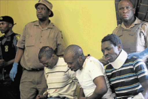 GOTCHA: Bongani Moyo, left, Khumbulani Sibanda and Leon Dube were caught after they tried to escape from Pretoria Central Prison yesterday. Photo: PEGGY NKOMO