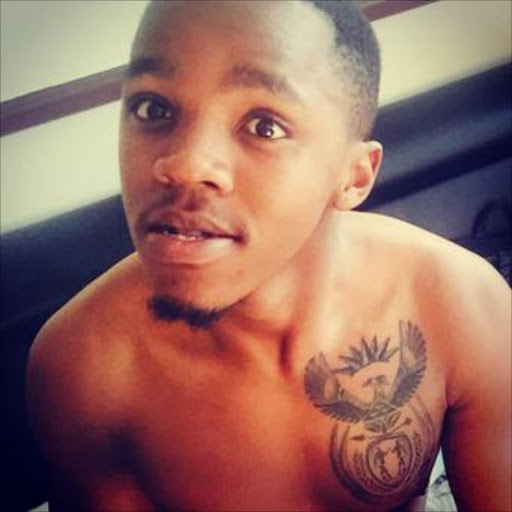 PATRIOTIC: Esethu Hasane got a tattoo of South Africa's coat of arms close to his heart.