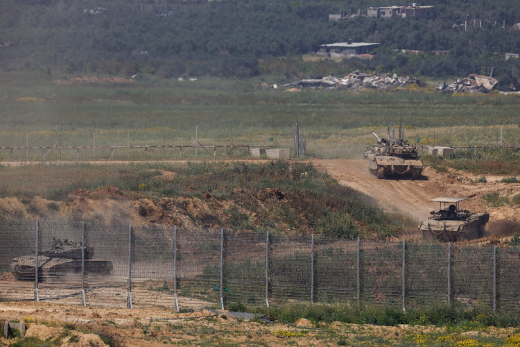 Israeli military vehicles manoeuvre near the Israel-Gaza border on April 4 2024. HANNAH MCKAY/REUTERS