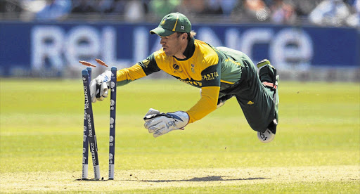 South Africa's AB de Villiers dives to attempt a run-out during the ICC Champions Trophy group B match against India in Cardiff, Wales, yesterday