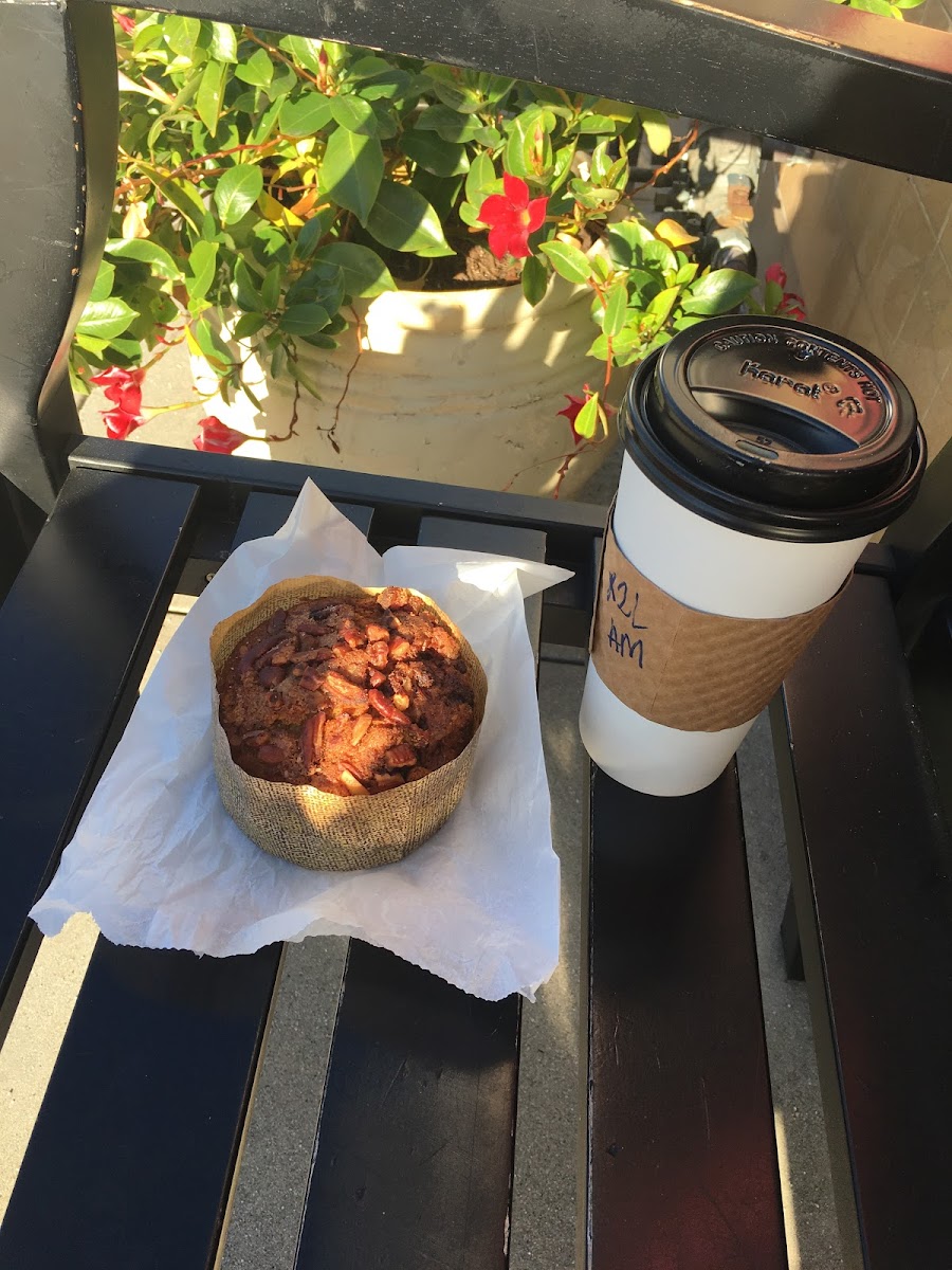 Gluten free banana nut muffin (that is their only gf carb choice) next to a large almond milk latte.