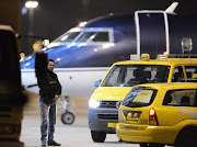 A plane carrying the Congolese war crimes suspect Bosco Ntaganda on board arrives at The Hague Airport in Rotterdam, The Netherlands.