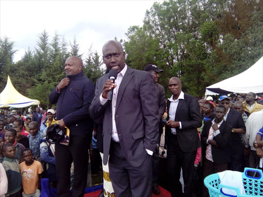 Erick Korir, running mate to Jubilee Nakuru Governor candidate Lee Kinyanjui, speaking at Olenguruone at a past rally. /AMOS KERICH