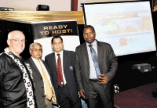 MOUSE AWAY: Mike Sutcliffe, Yusuf Bhamjee, Danny Jordaan and Zweli Mkhize at the launch of the first provincial 2010 website in Pietermaritzburg. 08/04/09. © Unknown.