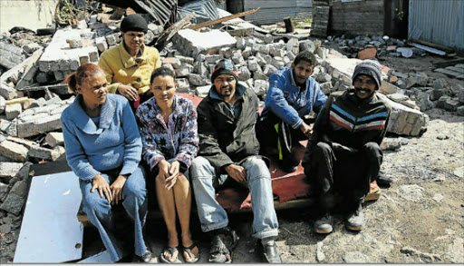 NOW HOMELESS: A Parkridge family was evicted on Thursday when a local pastor bulldozed their house. From left are Joyce Standard, Amber Scheepers, Ingrid Wyngaard, Randel Draghoender, Cinton Standard and Antonio van Rooyen. Picture: MICHAEL PINYANA