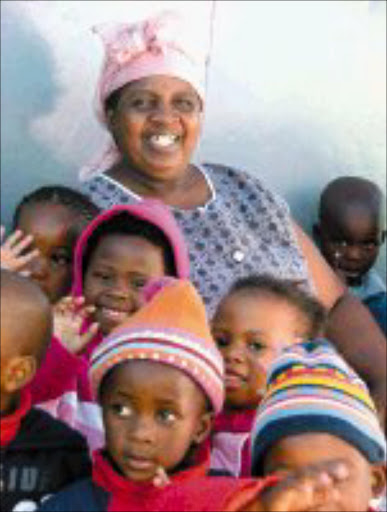 BIG HEART: Mama Amelia Poswa of Sakhumzi with some of the children in her care. © Sowetan.