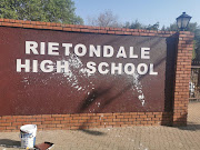 The wall on which the school's new name appears was vandalised on the weekend. 