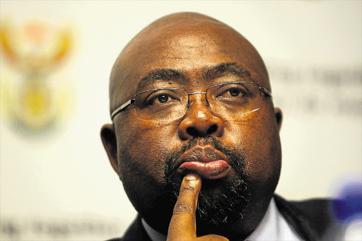 Public Works Minister Thulas Nxesi is all ears as Finance Minister Pravin Gordhan outlines his budget