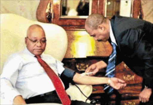 STATUS CHECK: President Jacob Zuma has his blood taken for an HIV test to be done . photo: Ntswe Mokoena