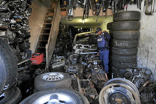 Police closed down a vehicle spares shop in Krugersdorp, on the West Rand, where stolen car parts were found and the owner arrested for being in possession of stolen items. / Veli Nhlapo