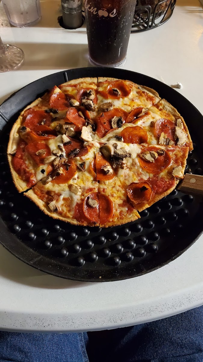 Cauliflower crust pepperoni and mushroom pizza. GF