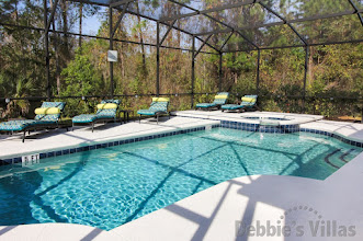 West-facing pool and spa with scenic views on gated Davenport community of Watersong