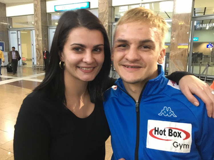 SA champion boxer Hekkie Budler pose for a photo with his wife shortly after arriving at OR Tambo International Airport from Japan on Tuesday May 22 2018.