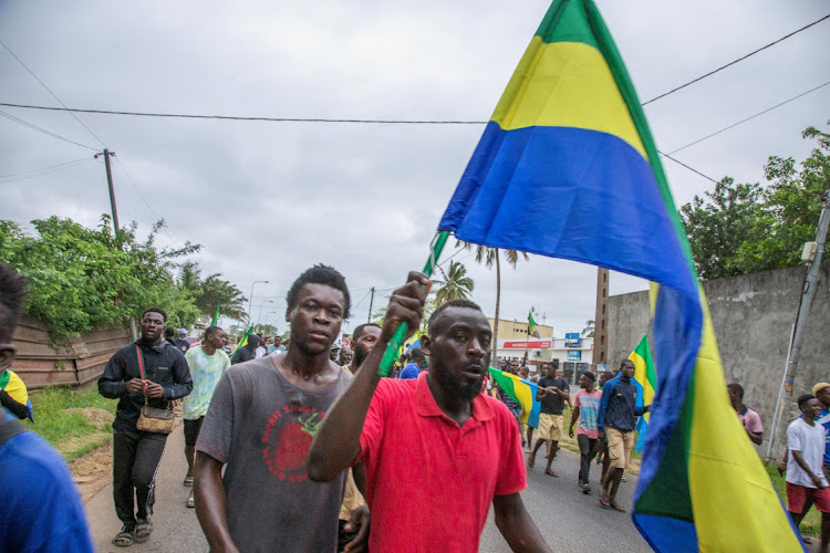 People celebrate the coup, in Port-Gentil, Gabon, August 30 2023. Picture: REUTERS