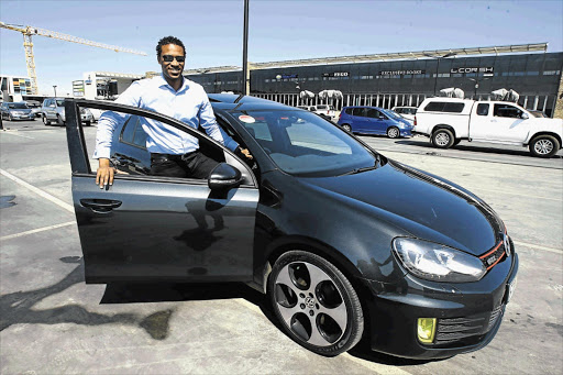 Racing driver Gugu Zulu with his VW Golf