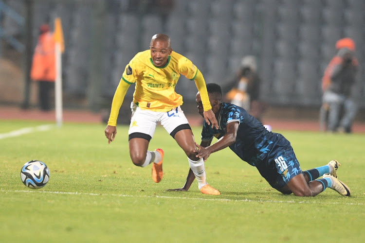 Thapelo Morena of Mamelodi Sundowns is challenged by Mashweu Mphahlele of Moroka Swallows in the DStv Premiership clash at Dobsonville Stadium on Monday night.