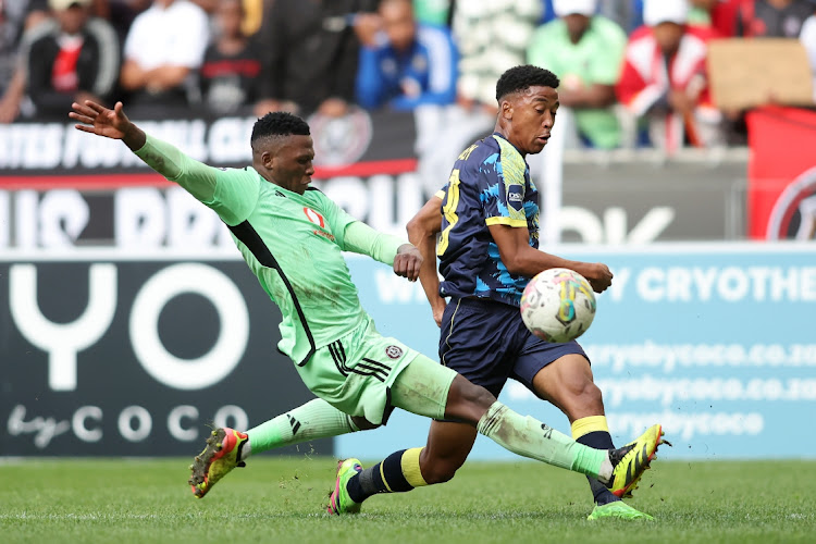 Thabiso Monyane of Orlando Pirates challenges as Heaven Sereetsi of Cape Town City sends a cross during their DStv Premiership match at DHL Cape Town Stadium on Wednesday. Bucs won 2-0.
