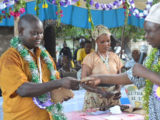 Matuga MP Hassan Mwanyoha and Kaloleni MP Gunga Mwinga at Tiwi market last November 29 during a funds drive to support women’s groups.