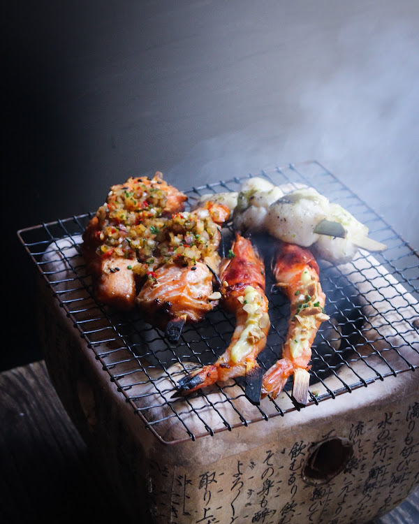 Robatayaki salmon teriyaki, lobster tail with citrus pepper, shrimp with smoked pepper and honey soy.