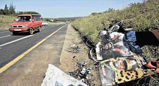 Flyers with pictures of King Goodwill Zwelithini litter the scene of the accident in which a car in the king's blue-light convoy collided with journalist Tim Ncube's car, killing him and the driver of the convoy car, Sergeant Thembinkosi Mpanza Picture: TEBOGO LETSIE