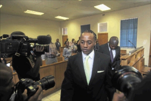 FACING THE MUSIC: Popular hip-hop musician Molemo 'Jub Jub' Maarohanye and co-accused Themba Tshabalala during their murder trial in the Protea Magistrate's Court. PHOTO: VELI NHLAPO