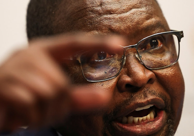 South Africa's finance minister Enoch Godongwana speaks at a press conference ahead of his 2024 budget speech in Cape Town on February 21 2024.