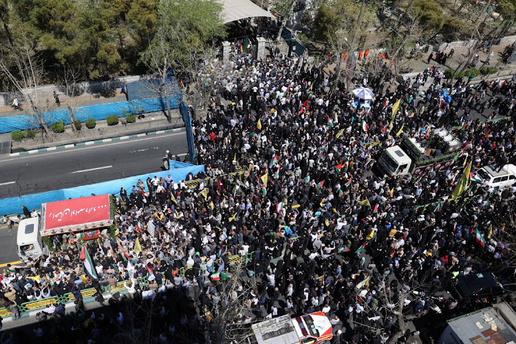 Iranians attend a rally marking Quds Day and the funeral of members of the Islamic Revolutionary Guard Corps who were killed in a suspected Israeli airstrike on the Iranian embassy complex in the Syrian capital Damascus, in Tehran, Iran, April 5, 2024.