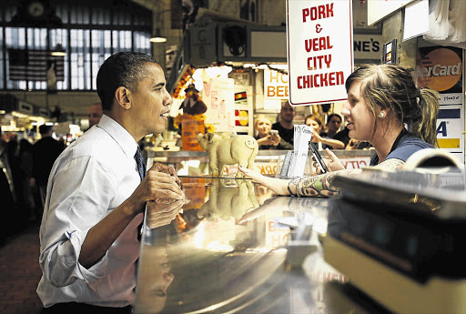 President Barack Obama at the West Side Market during a campaign stop in Cleveland at the weekend Picture: KEVIN LAMARQUE/GALLO IMAGES