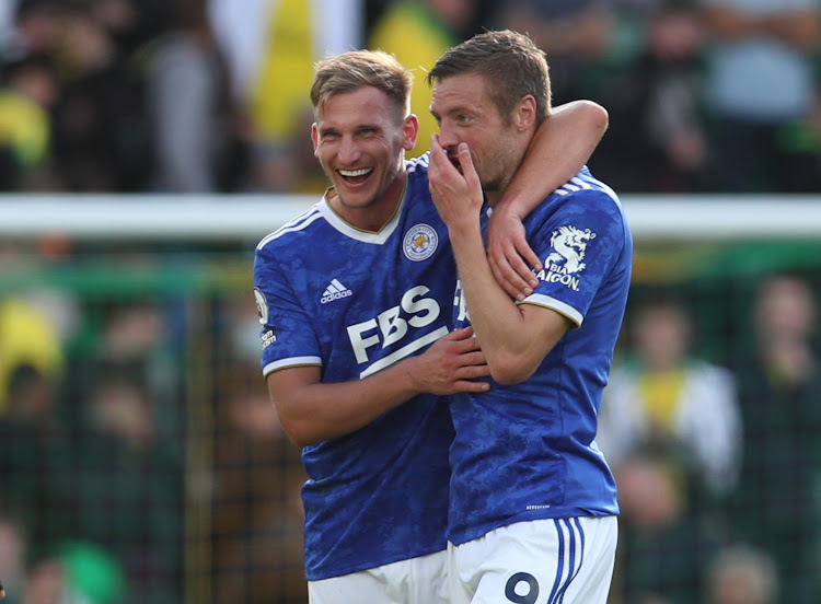 Leicester City's Jamie Vardy celebrates with Marc Albrighton after the match