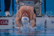 Pieter Coetzé in action in the 100m backstroke final at the world championships in Doha.