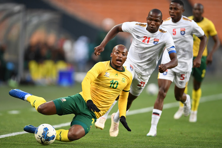 Bafana Bafana's Khanyisa Mayo is upended by Eswatini's Sifiso Matse during the international friendly at FNB Stadium in Johannesburg in October 2023.