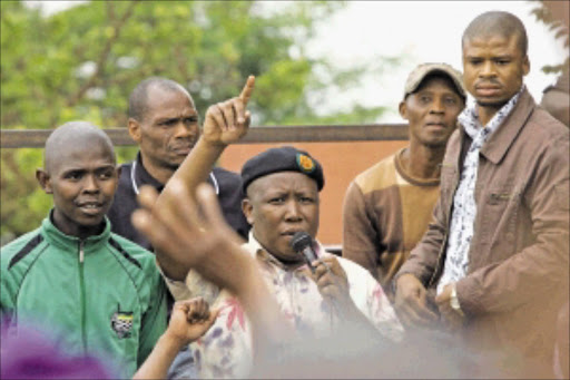 IN TROUBLE AGAIN: ANCYL president Julius Malema addressing Thembelihle informal settlement residents near Lenasia, south of Johannesburg. PHOTO: ANTONIO MUCHAVE.