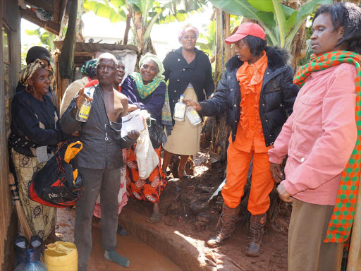 Illicit brew seller Franco Okori is questioned by members of Destiny of King'eero Women's Group who raided his home on the morning of November 23, 2016. /GEORGE MUGO